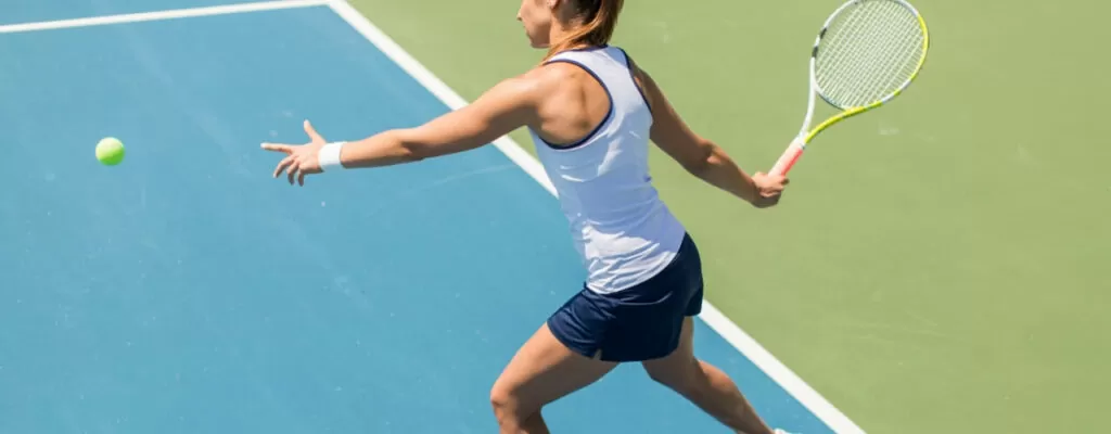 Physical therapy session helping a tennis player with shoulder pain relief
