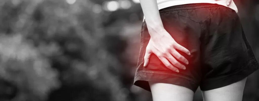 Physical therapist treating sports-related sciatica and radiating pain."